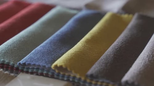 Close up view colorful fashion fabric samples. Textile textures swatches concept. Woven fabric is an