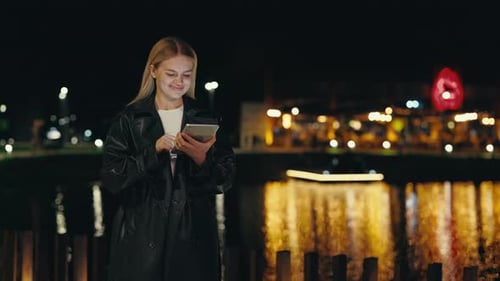 Pretty Girl Smiling Standing Near City Lake Using Digital Tablet Night Time