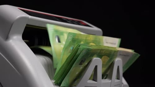 Euro Banknotes Being Counted By Machine