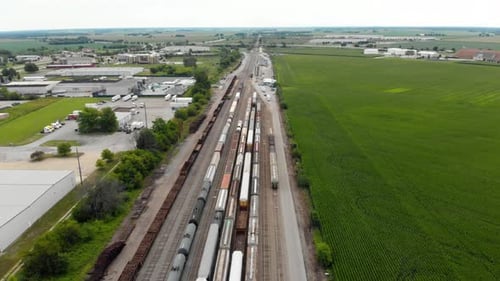 4k aerial view of multiple trains waiting to leave a train station