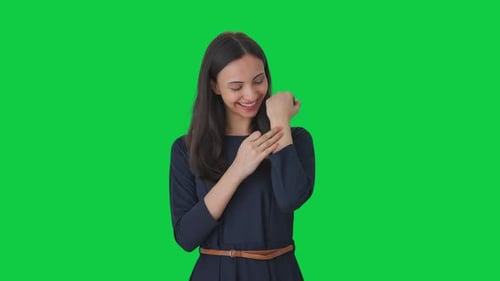 Happy Indian girl removing the bandage Green screen