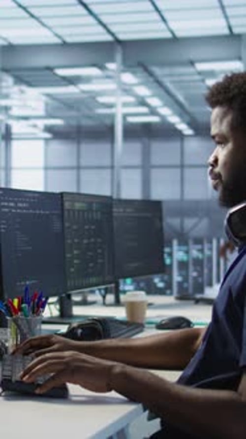 Vertical Video Woman Assisting Data Center Programmer in Solving Tasks