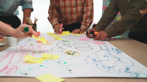 Team brainstorming session in a modern office with colorful sticky notes and creative collaboration