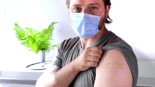 Man Gives Thumbs Up After Vaccination