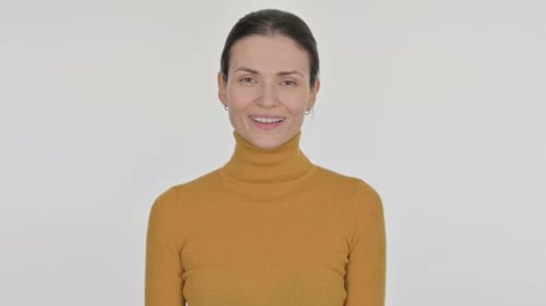 Smiling Woman in Yellow Turtleneck Posing
