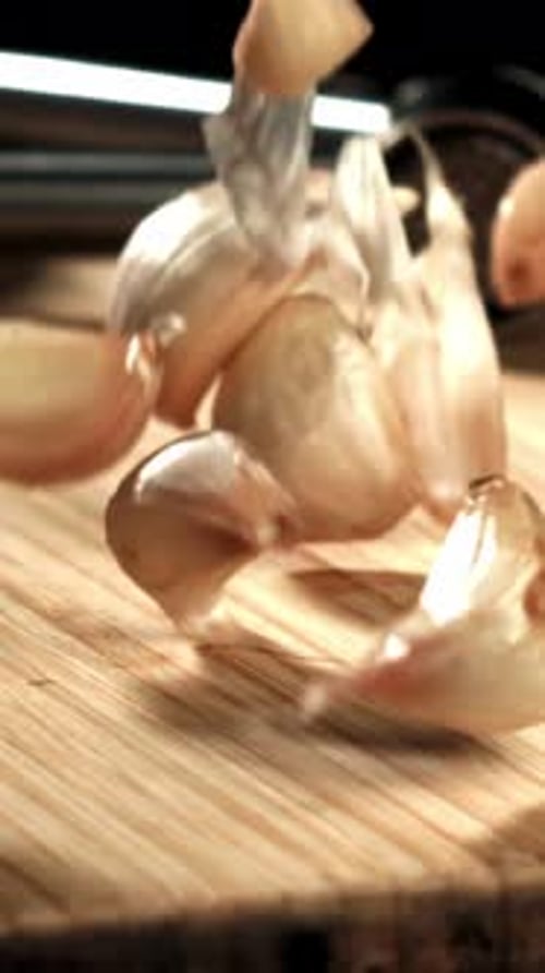 Fresh Garlic Falls on a Cutting Board Filmed on a Highspeed Camera at 1000 Fps