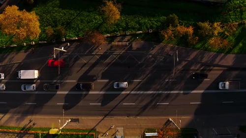 Car dropping of a passenger in a Bus Stop. Heavy traffic, Top down view.