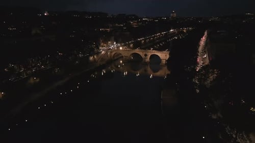 Aerial video on Tiber river with night lights in Rome Italy