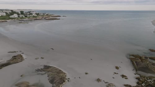 Aerial view of sandy beach and waves, United States.