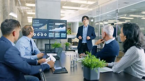 Business Presentation with Diverse Team in Modern Office