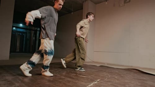 Two Young Adults Dance in Urban Interior