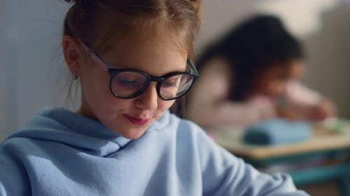 Portrait of Smiling Pupil Learning at School. Thoughtful Schoolgirl Holding Hand On