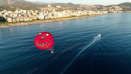 Parasailing Over the Sea at the Most Beautiful Sunset Hour