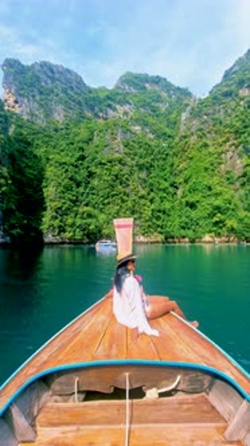 Pileh Lagoon with Green Emerald Ocean at Koh Phi Phi Thailand Women in Front of Longtail Boat