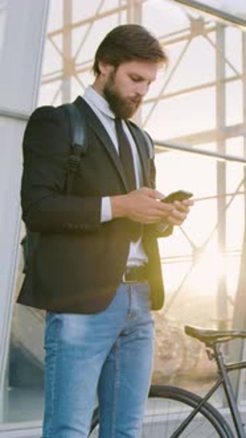 Man Office Manager with Wellgroomed Beard in Formal Clothes Stopped Near Big Modern Building and