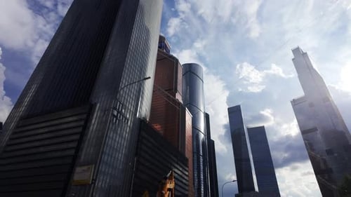 The Urban Business District Features Modern Skyscrapers Set Against Cloudy Skies