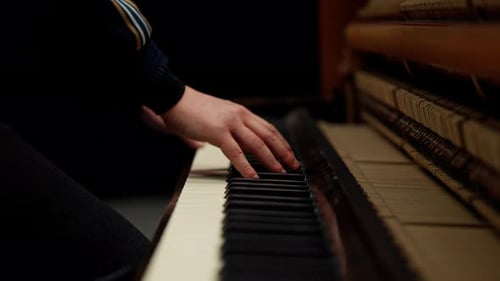 Hands Gracefully Play an Elegant Piano