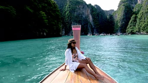 Asian Women in Front of a Longtail Boat at Koh Phi Phi Island Thailand Pileh Lagoon