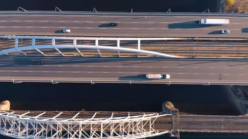 Cars Traffic on Highway Bridge Road Over the River