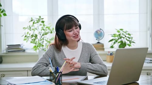 Woman at Computer Video Calling From Home Office