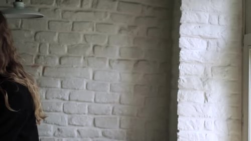 Young Woman Working on Her Laptop Computer in Coffee Shop