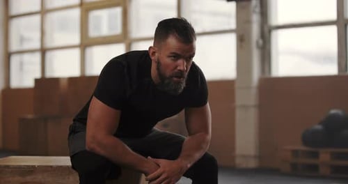 Fit Young Man Looking Exhausted After a Gym Workout Active