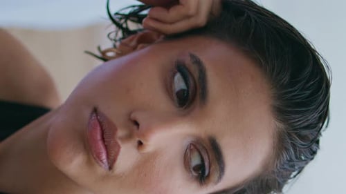 Woman Lying Down with Short Wet Hair