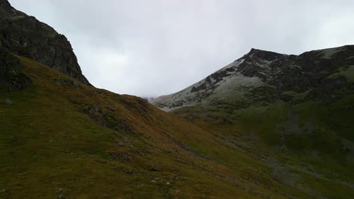 Aerial View of Mountainous Terrain in Overcast Conditions