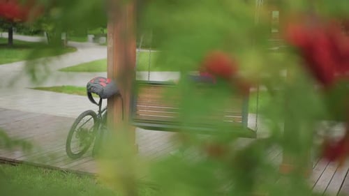 Girl rests on swing after riding her bike