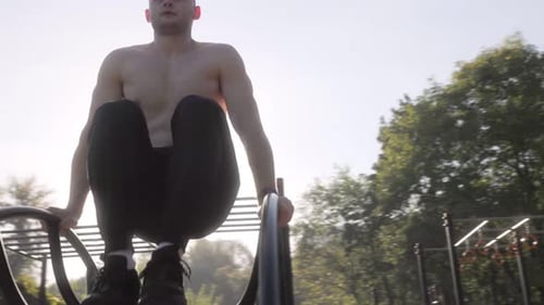 Athletic Male with Naked Torso Committed to Outdoor Fitness and Health