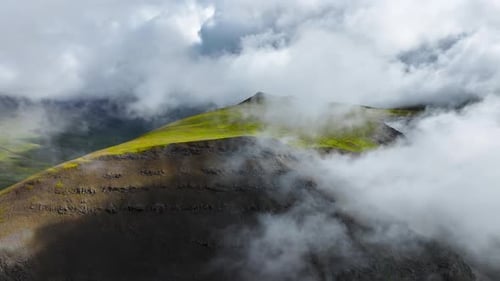 Flying Through Clouds Above Hills Cowered With Green Grass Paradise Heaven Mountain Range With High