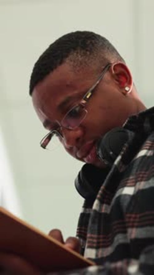 Black Man Reads Textbook in Public Library