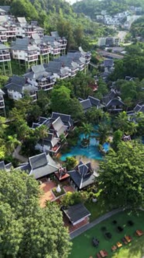 Tropical Resort Aerial View with Swimming Pools and Beach