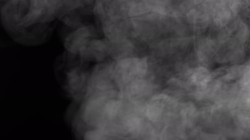 Subtle plumes of vapor float on black background