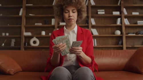 Woman Counting Cash in a Luxurious Home