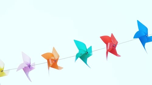 Multicolor Pinwheels Gently Spinning in the Breeze