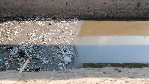 Polluted river in Mexico, Latin America and poverty
