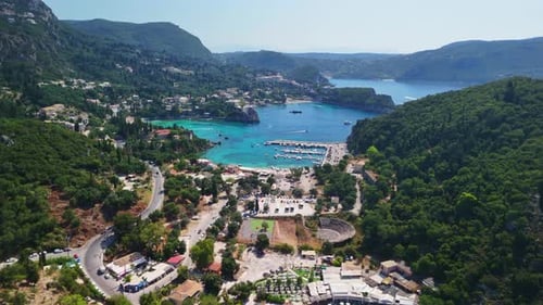 Breathtaking Aerial Shot of Vibrant Coastal Resort Surrounded by Greenery
