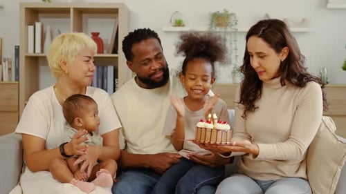 Diverse Family Celebrating Child's Birthday at Home
