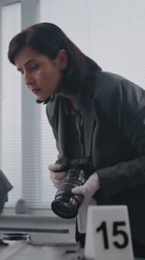 Woman Photographs Evidence at a Crime Scene