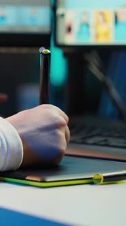 Hand Using Stylus on Graphic Drawing Tablet