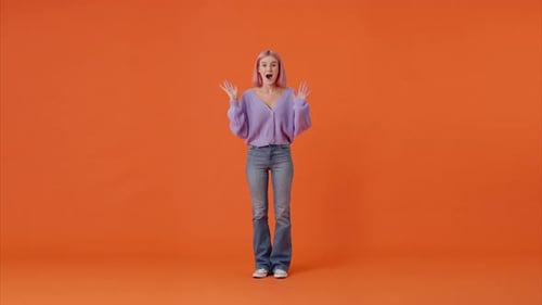Young Caucasian Woman Waving and Saying Hello in Studio
