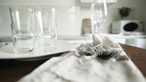 Glasses and Silverware Set Up in Modern Kitchen