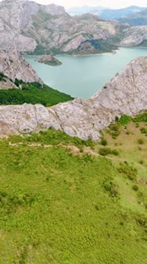 Grey bare rocks surrounding the beautiful lake. Nature of national park in Leon, Spain, Europe