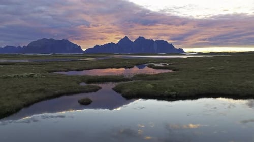 flying latterally over the field of valberg in Norway during sunrise