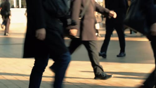 Slow motion crowd of people walking on street. Commuters going to work in the morning.