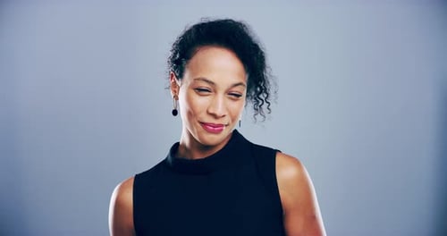 Woman Making Heart Shape with Hands, Laughing