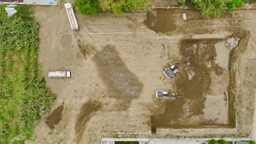 Aerial View of Excavators and Trucks on Construction Site