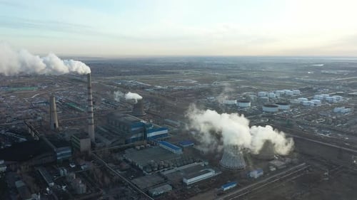 Aerial View of Thermal Power Plant Drone Flies Over Chimney Smoke Pipes and Cooling Towers of