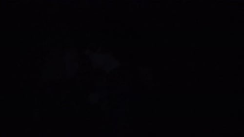 Male Model Against Bright Strobing Light on Black Background in Studio Man Clubber Silhouette